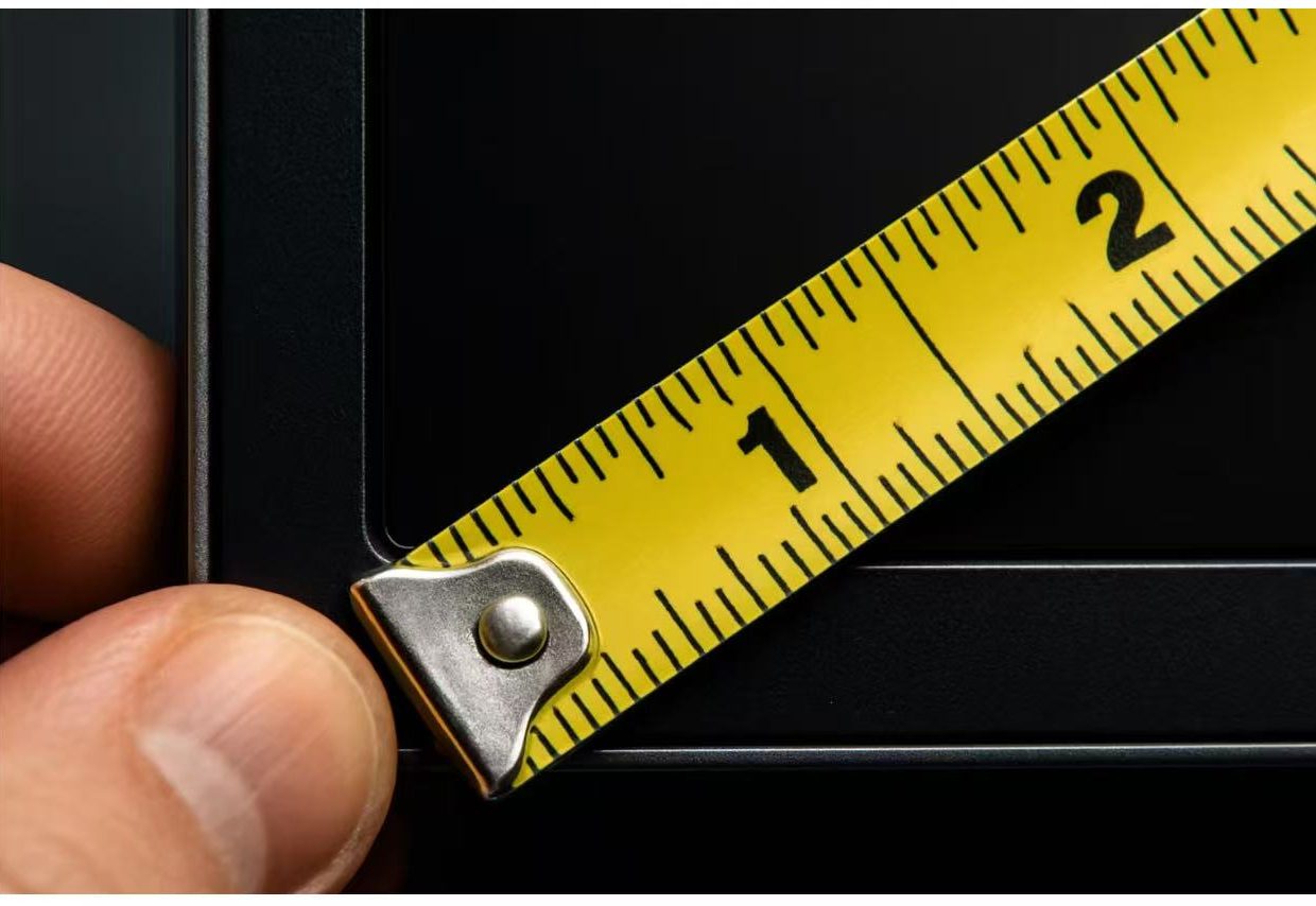 A soft tape measure the distance from the bottom-left corner to the top-right corner of the screen's active viewing area only, excluding the bezel.