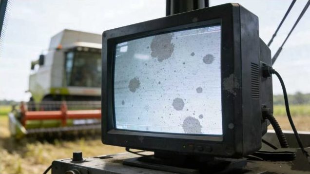 Close-up of a ruggedized industrial control panel display showing a small, faint grey spot on phone screen defect, highlighting the critical nature of industrial display module defects in operational settings.